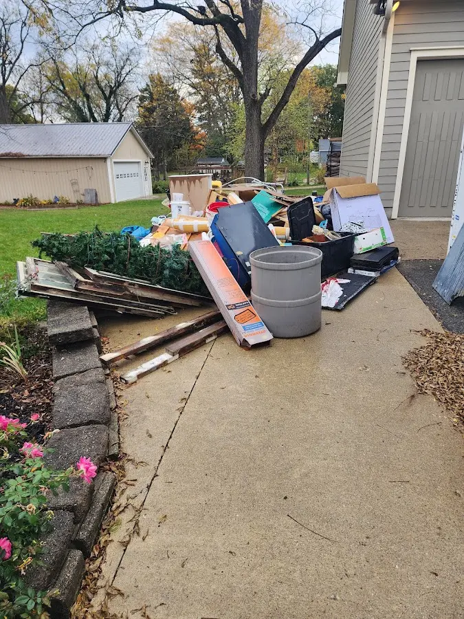 Dumpster being loaded with debris for Commercial Dumpster Rental in Commerce
